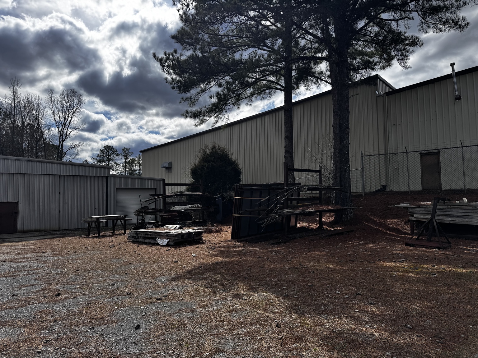 Rear service area and adjoining improvements.