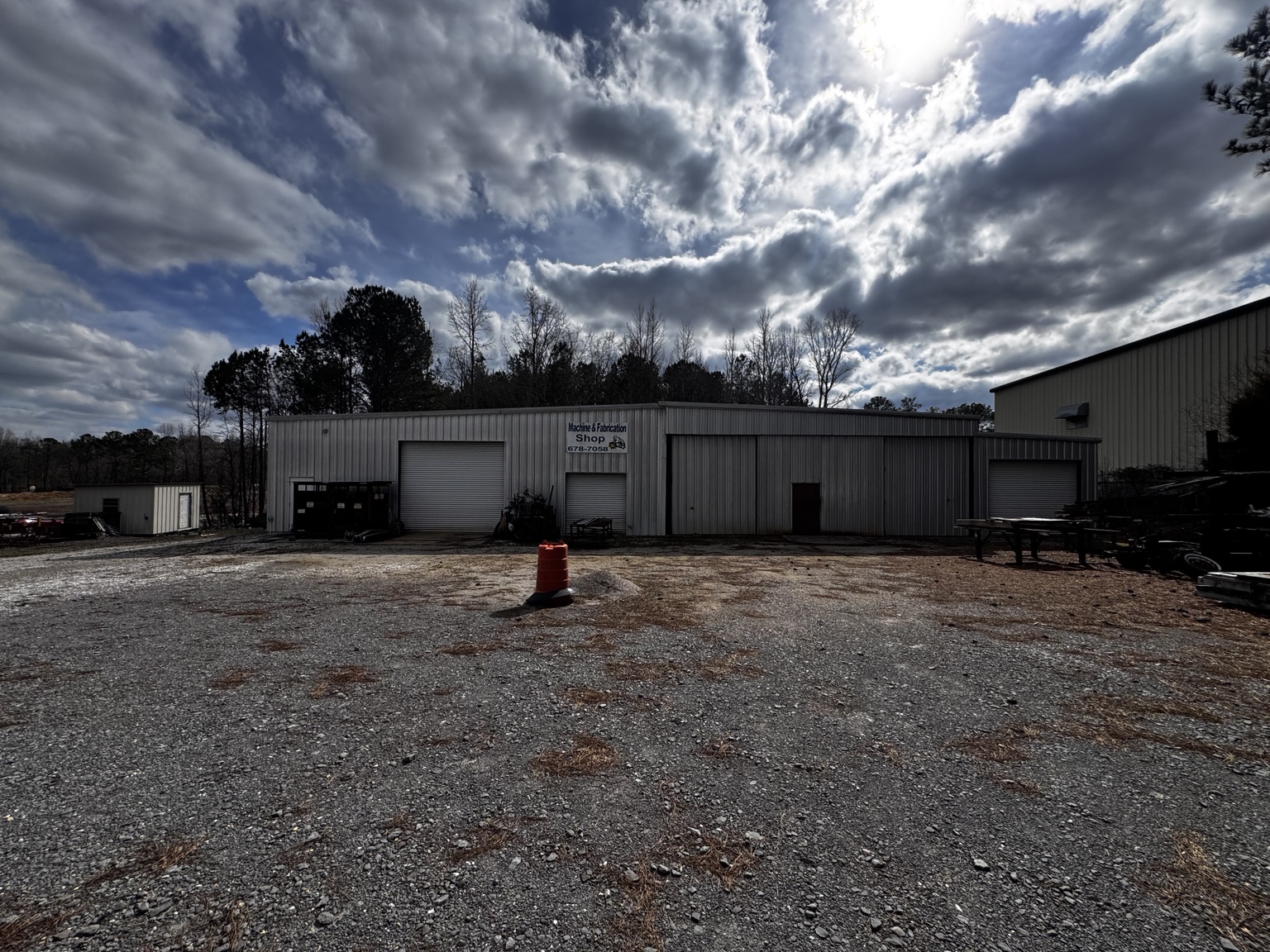 Main shop building and gravel yard.